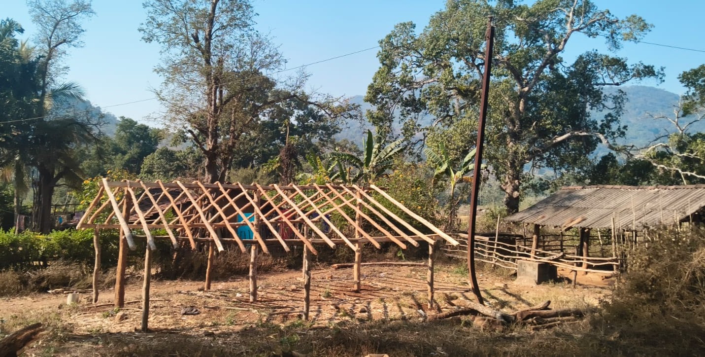 Church structure in the forest before the roof is completed